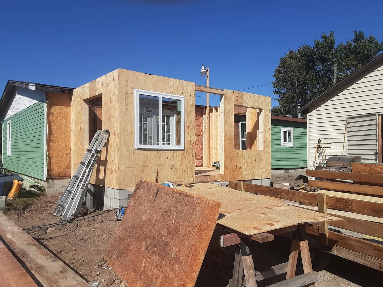 Exterior wall framing and structural carpentry in progress
