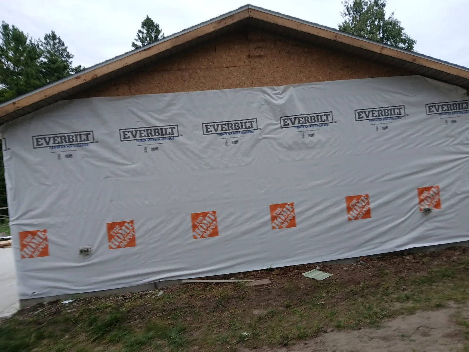 Exterior remodeling with house wrap before siding finish
