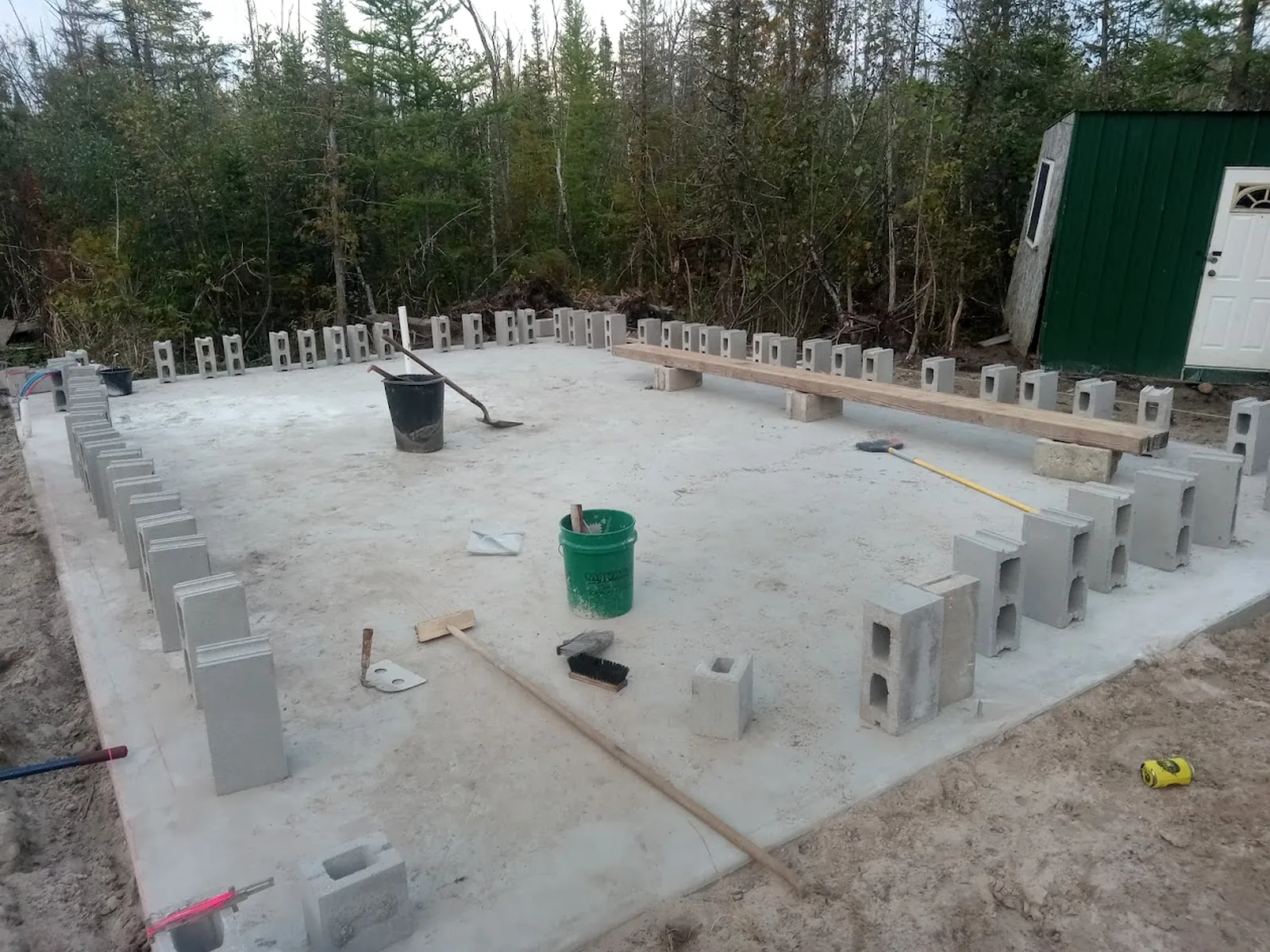 Concrete slab and block foundation work for a structure